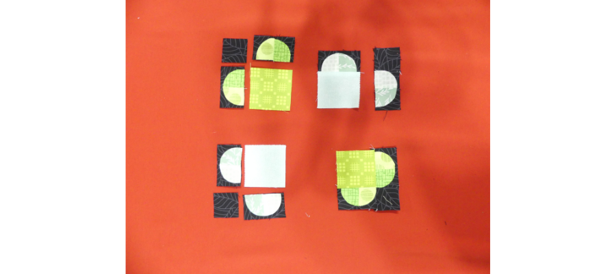 Pieces lined up for the clover mug rug tutorial assembly